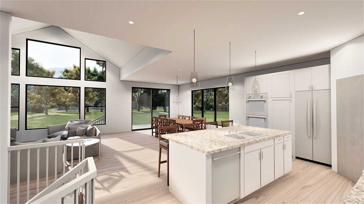 Open-concept living area with vaulted ceiling, large windows, kitchen island, dining area and living room.