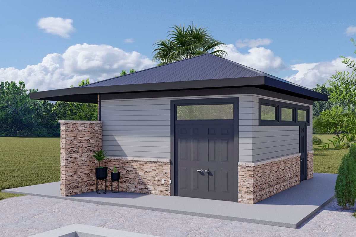 Modern garage exterior with gray siding, stone base, dark gray doors, and a dark metal roof with wide overhangs.
