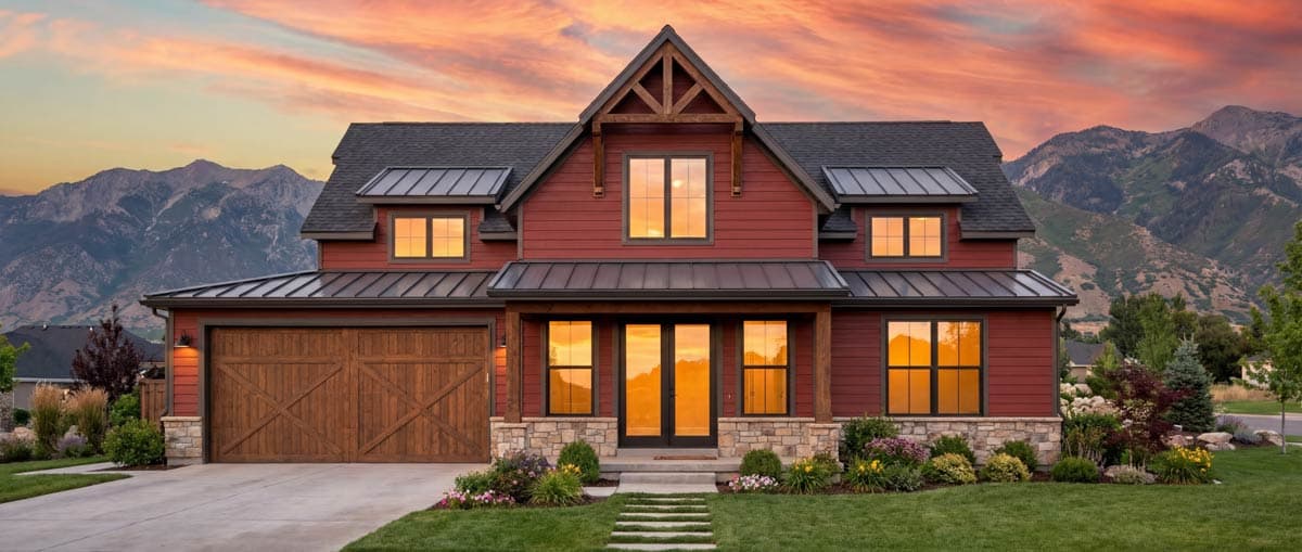 House plan exterior: Modern Farmhouse style, two stories, prominent gable with wood accents, metal rooflines, stone base, and wood garage door.