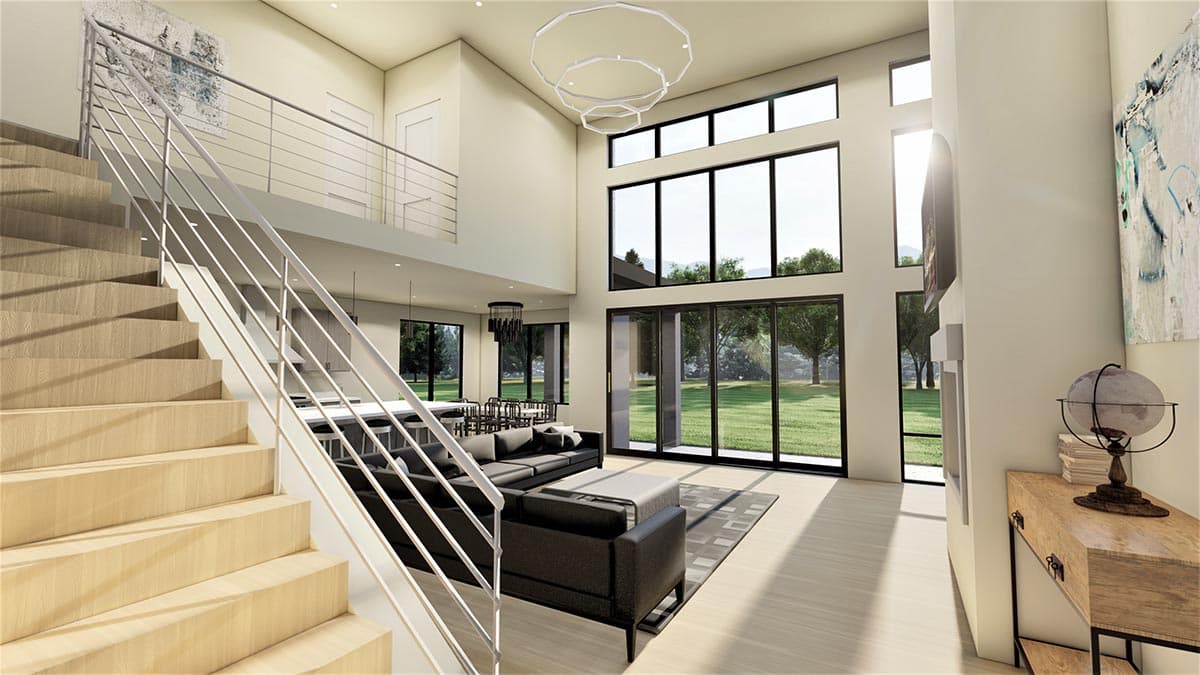 Interior rendering of a two-story great room with open staircase, modern chandelier, and floor-to-ceiling windows.