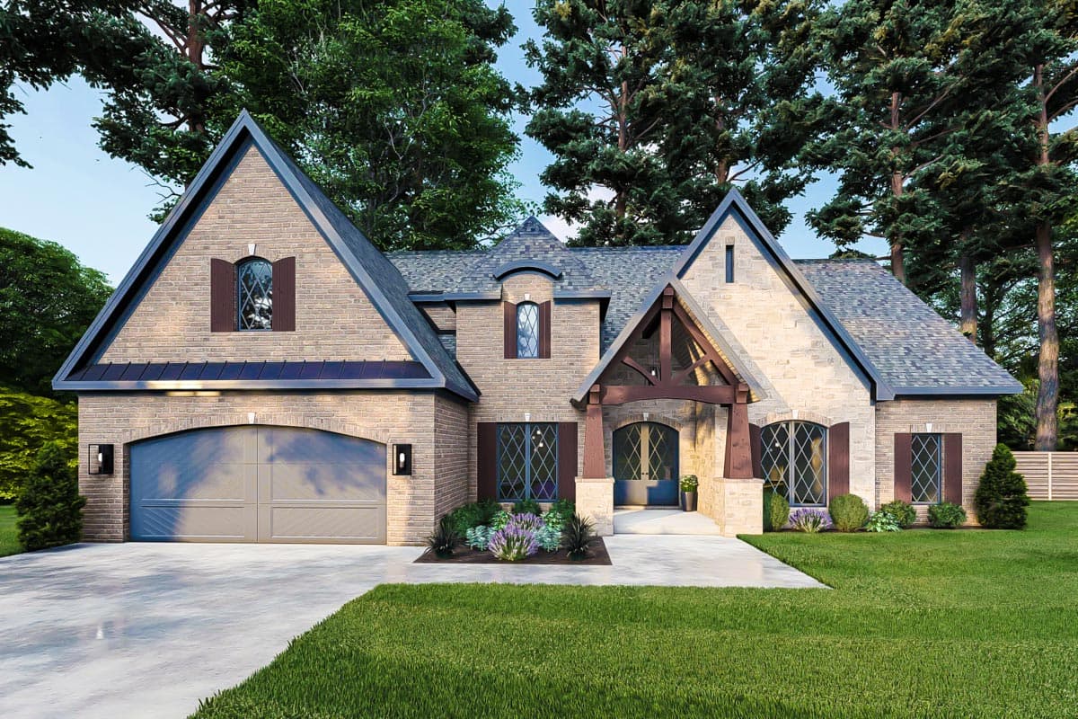 House plan exterior with stone and brick facade. Features include multiple gables, arched entry and garage, and decorative shutters.