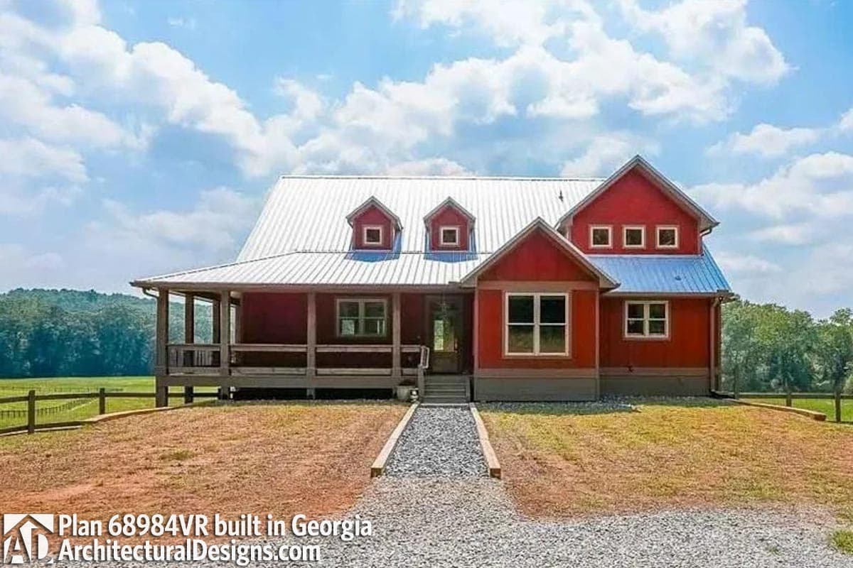 Modern farmhouse exterior plan with a wraparound porch, metal roof, dormers, and prominent gables.