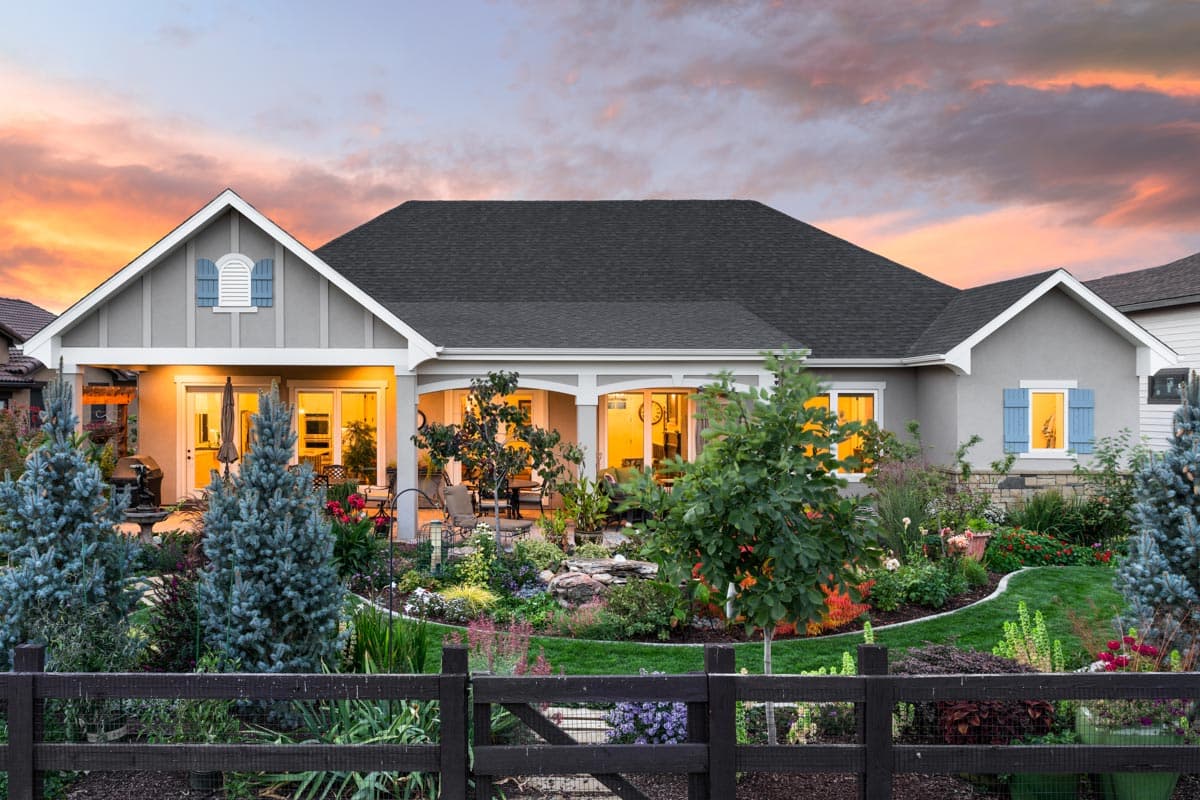 House plan exterior, single-story home with gables, dormer, covered patio, and detailed landscaping.