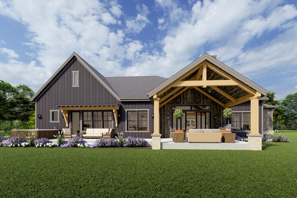 House plan exterior with a modern farmhouse style, gabled roofline, expansive covered porch with exposed beams, and a deck with a hot tub.