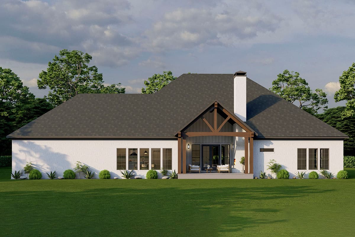 House plan exterior: One-story Modern Farmhouse with white brick, dark gabled roof, large chimney, and covered patio with exposed beams.