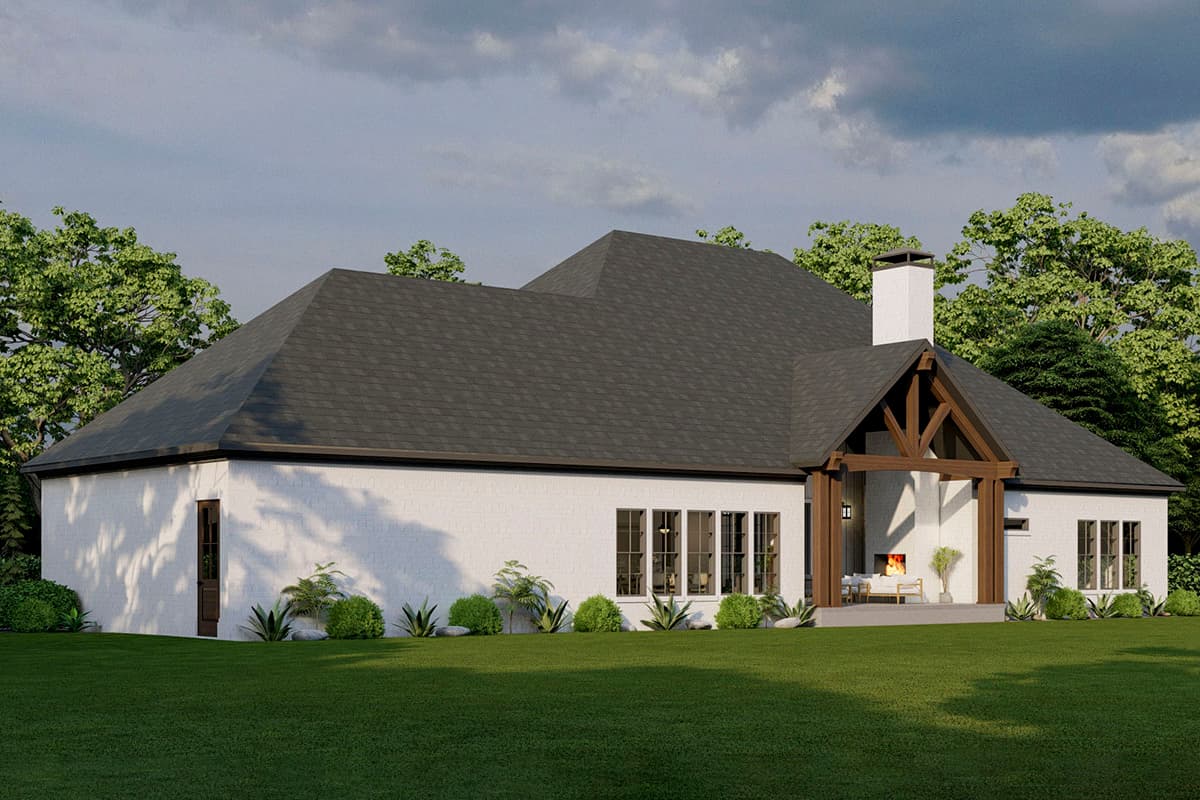 House plan exterior, white brick, one story, gabled roof, exposed beams, and covered patio with fireplace.