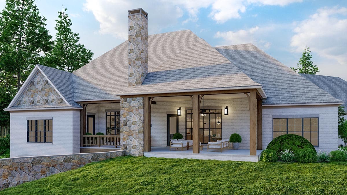 House plan exterior with stone chimney, covered patio, gables with stone accents, and white brick walls.