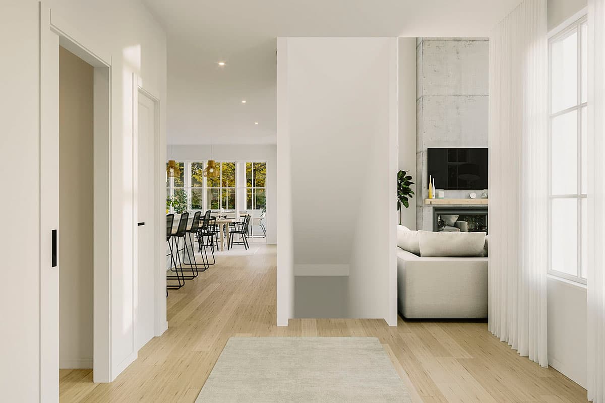 Open concept interior rendering showing a dining area with island seating and a living room with a fireplace and television.