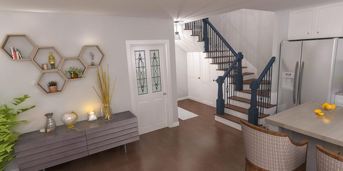 Interior view of a house entrance and kitchen area with a dark blue staircase, white door with decorative glass, and stainless steel refrigerator.