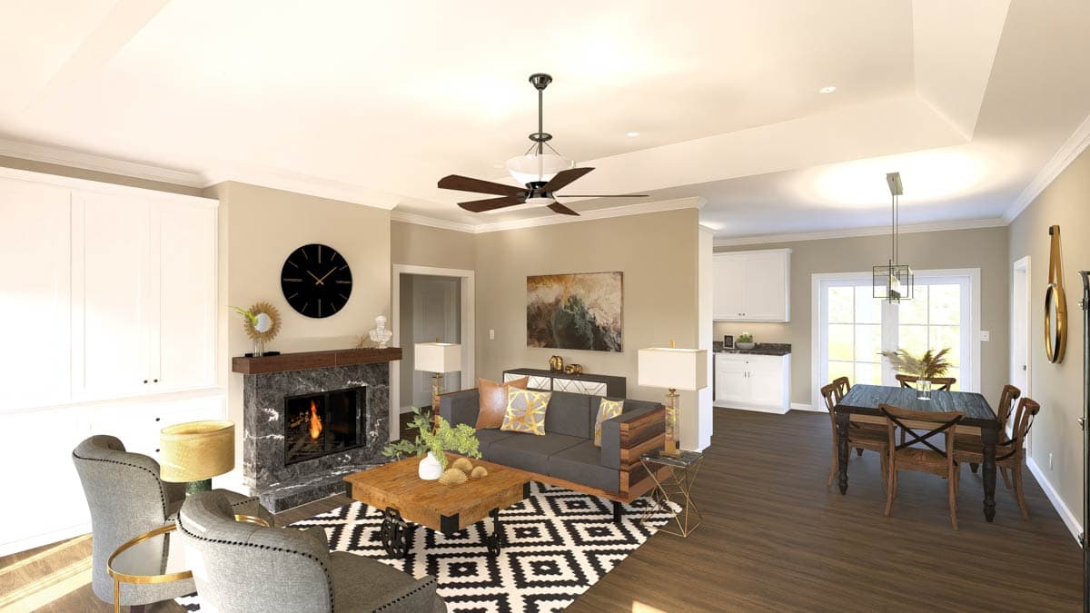 Interior rendering of a great room with fireplace, seating area, dining table, and kitchen visible. Open layout.
