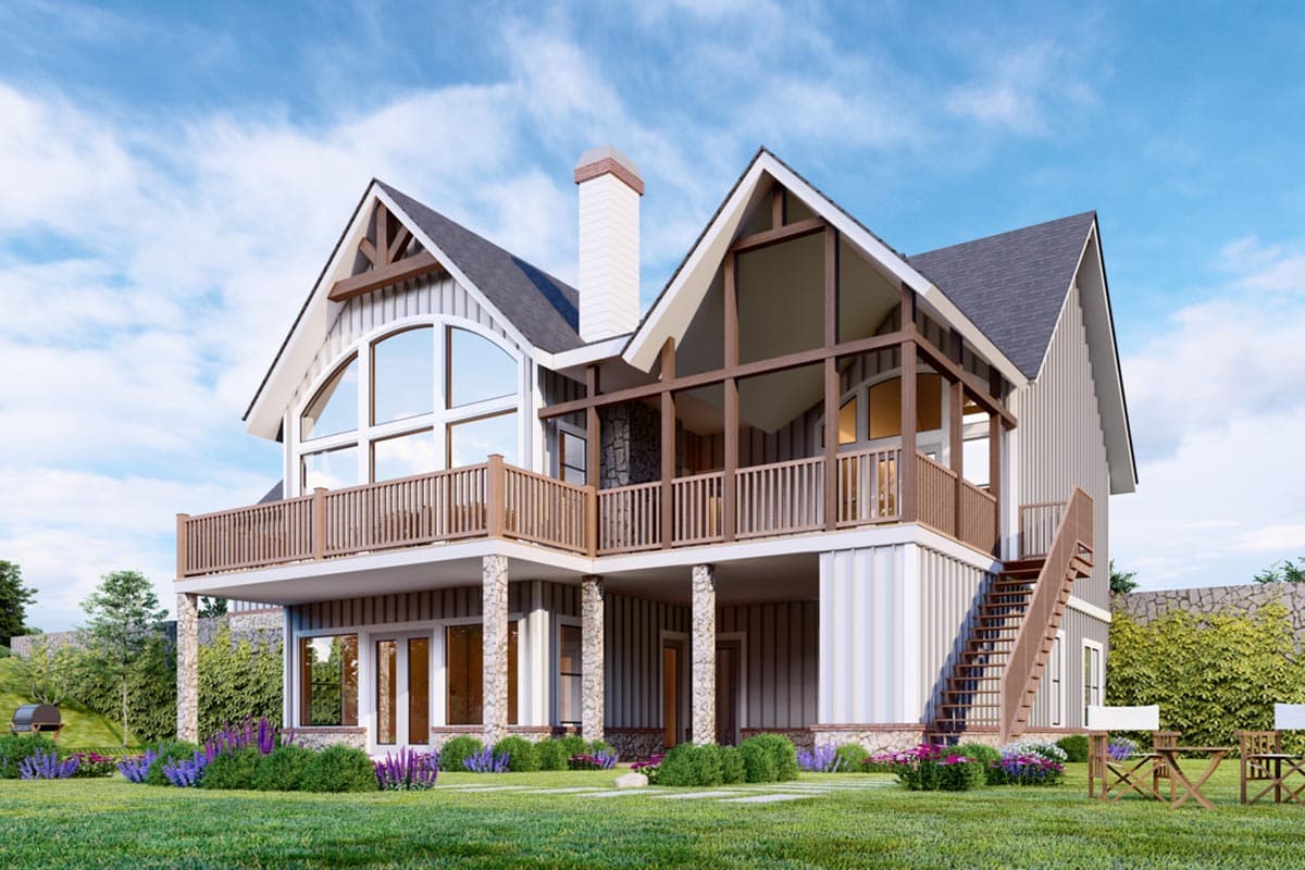 House plan exterior: two-story Modern Farmhouse with large arched window, wraparound deck, and exposed timber beams.