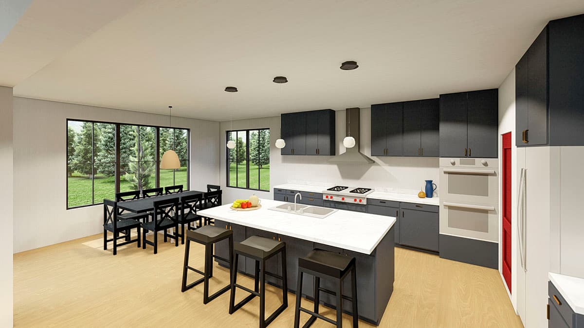 Modern kitchen and dining area with island, stainless steel appliances, large windows, and light wood flooring.