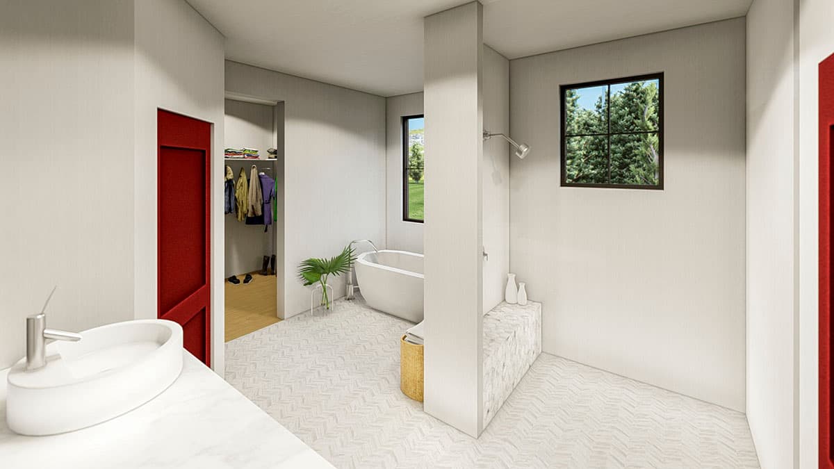 Modern bathroom with freestanding tub, walk-in closet with red door, and double vanity.