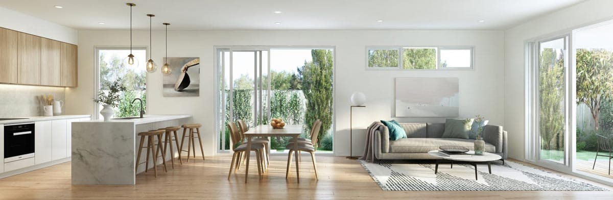 Open-concept living space featuring a modern kitchen with island, dining area, and sofa.