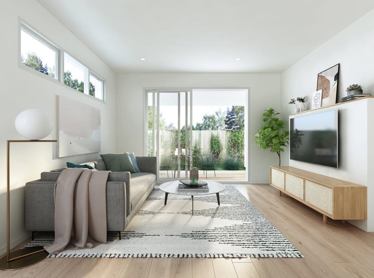 Living room with sliding glass doors to backyard, modern sofa, coffee table, and media console.