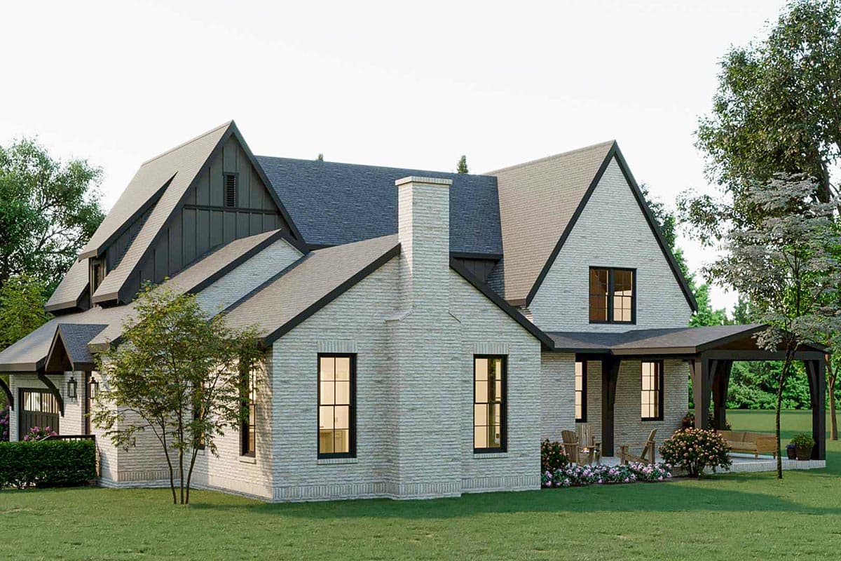House plan exterior: Two-story Modern Farmhouse with brick exterior, prominent gables, metal accents, and covered patio.