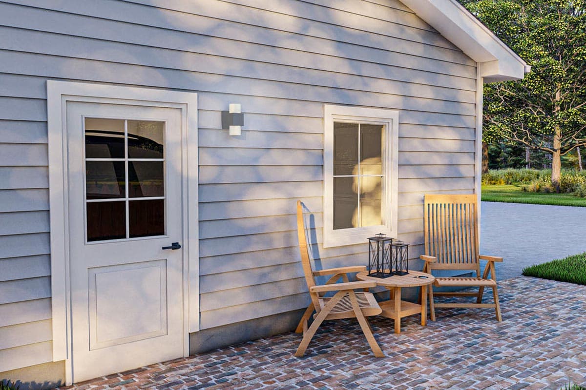 House plan exterior: clapboard siding, single-story, door with multi-pane glass, and one window.