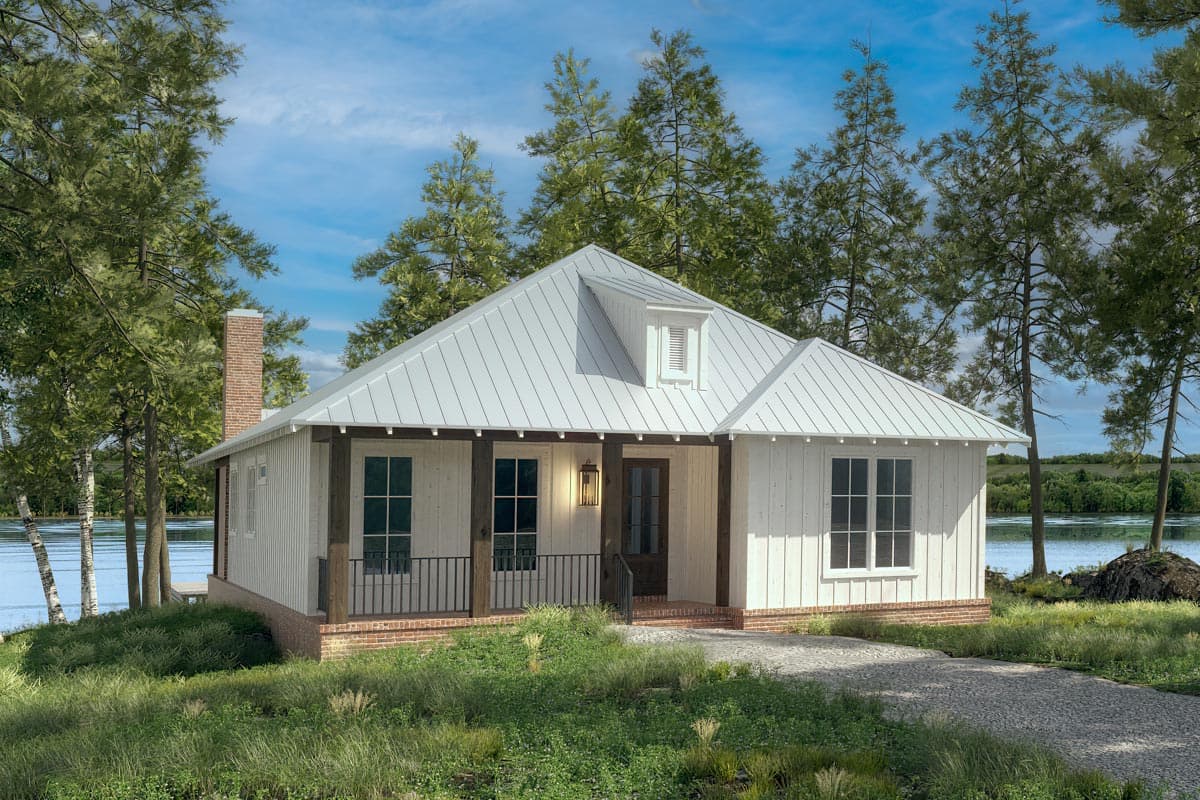House plan exterior. One-story Cottage style home with gabled roof, brick foundation, dormer, and front porch with dark columns.