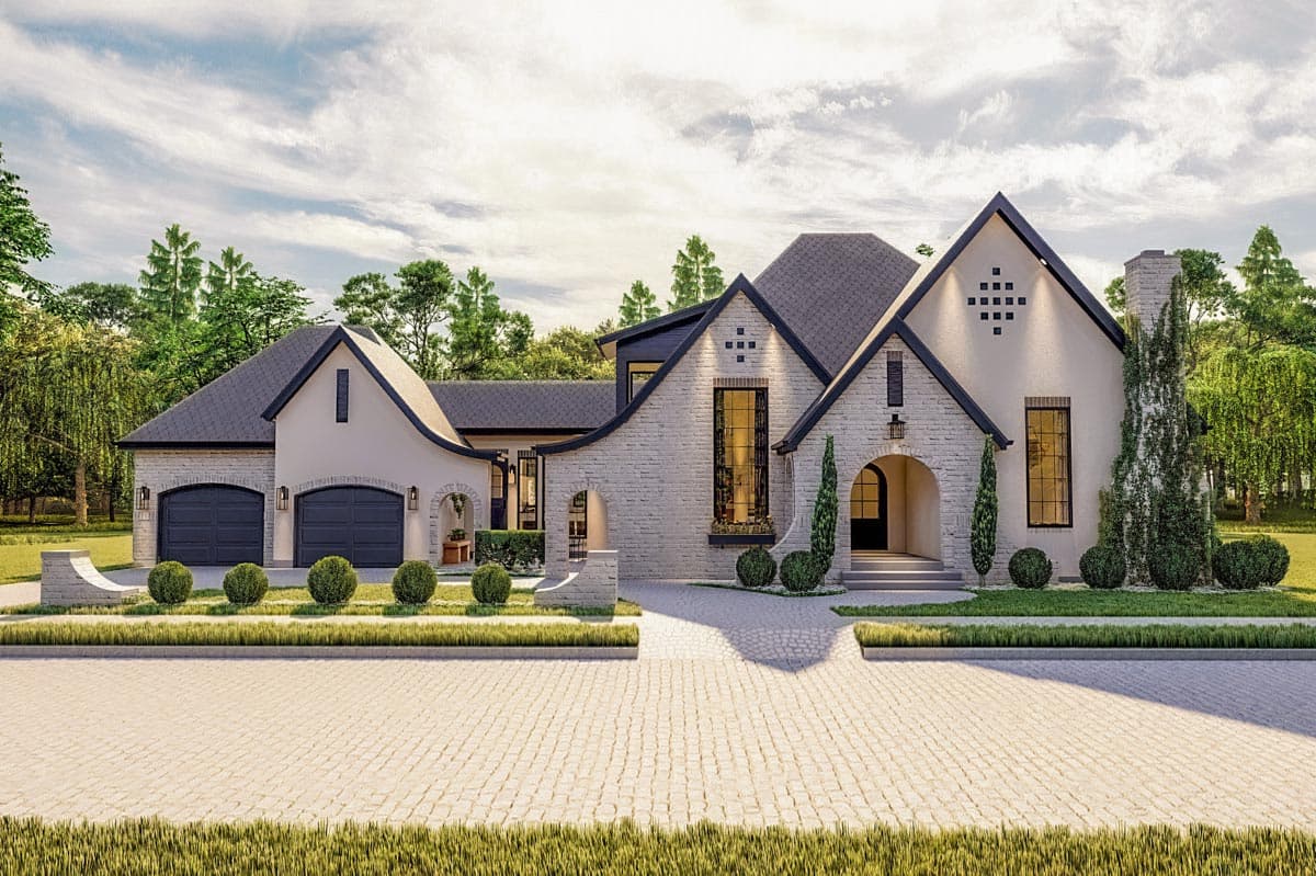 House plan exterior with arched entry, brick facade, and multiple gables. Features a two-car garage and a tall chimney with a dark roofline.