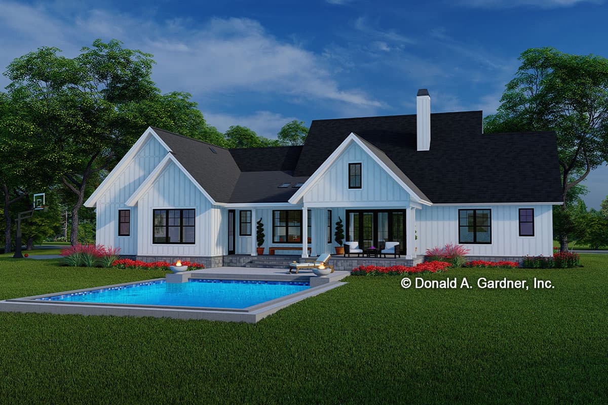 Modern Farmhouse house plan exterior with gables, white board-and-batten siding, covered porch, and swimming pool.