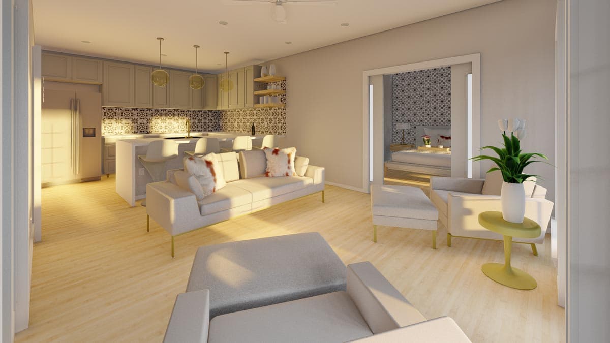 Open-concept living area with kitchen island, sofa, and view into bedroom with patterned wallpaper.