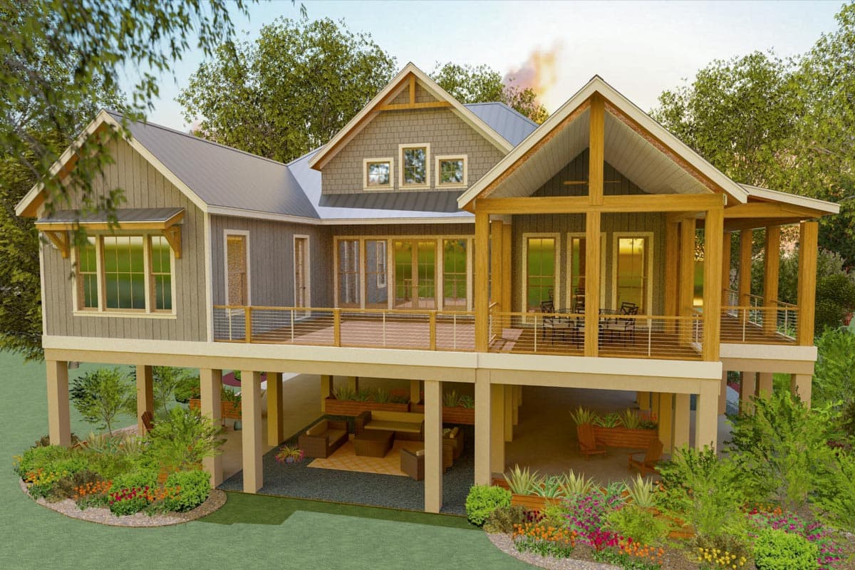 House plan exterior featuring a raised foundation, multiple gables, a wraparound deck, and exposed timber framing on a covered porch.