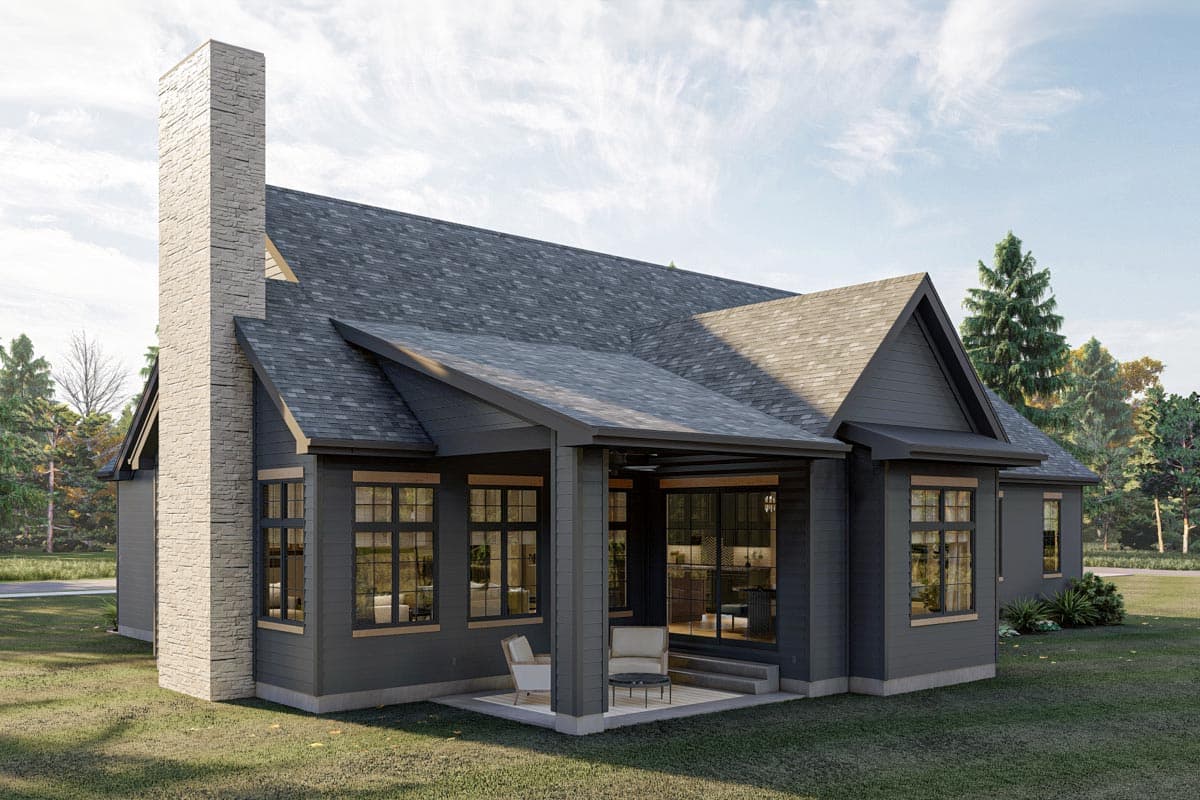 House plan exterior: single-story Modern Farmhouse with stone chimney, gabled roof, covered patio, and large windows.