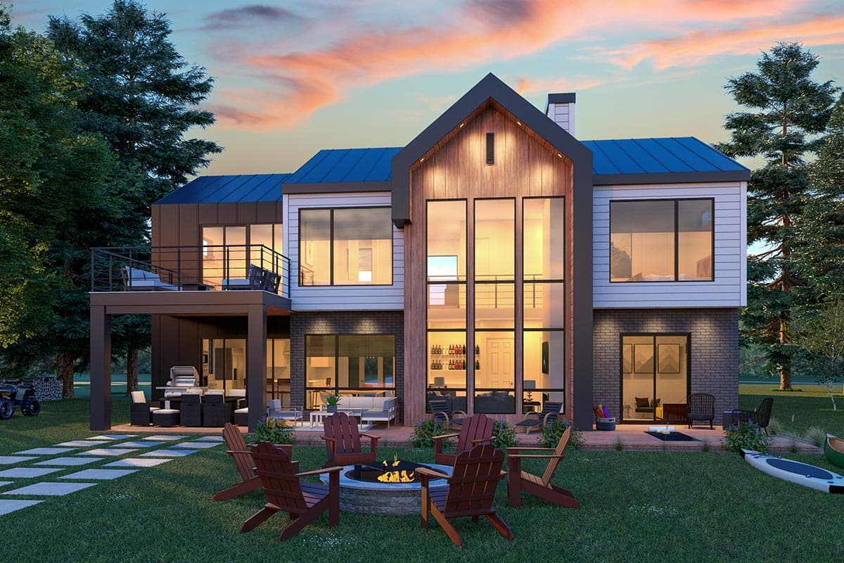 Modern house plan exterior with a prominent central gable, metal roof, large windows, and a second-story balcony.