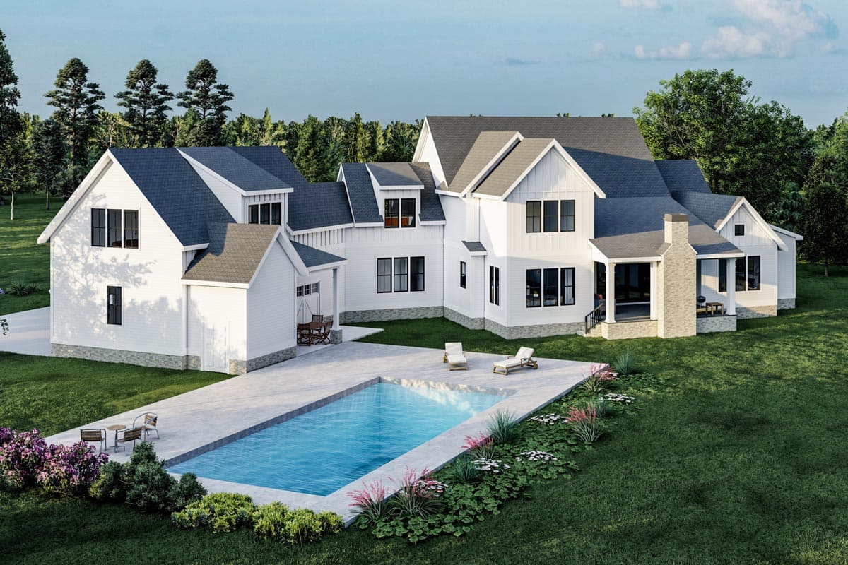 Modern Farmhouse house plan exterior with white siding, multiple gables, dormers, a covered porch, and attached garage.