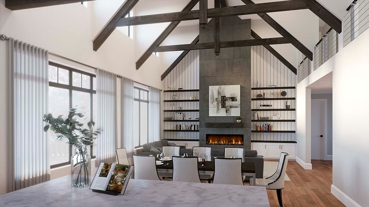 Great room with vaulted ceiling, exposed beams, stone fireplace, built-in shelving, and large windows.