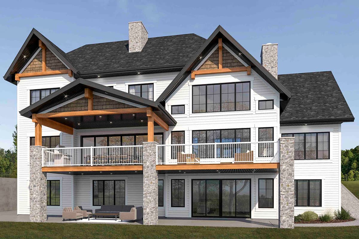 House plan exterior view of a multi-story home with gabled roofs, exposed wood beams, stone chimney, and covered deck.