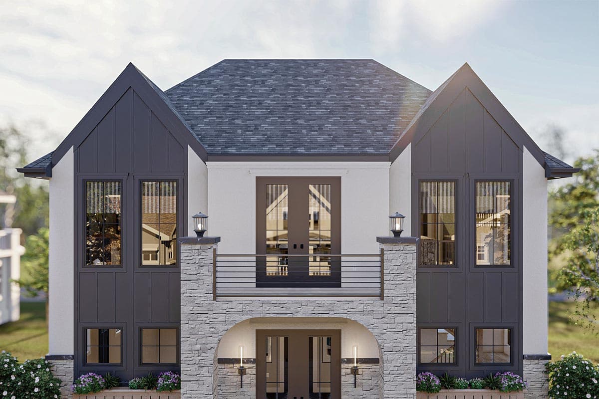 House plan exterior featuring a Modern Farmhouse style with multiple gables, stone archway entrance, and second-story balcony with French doors.