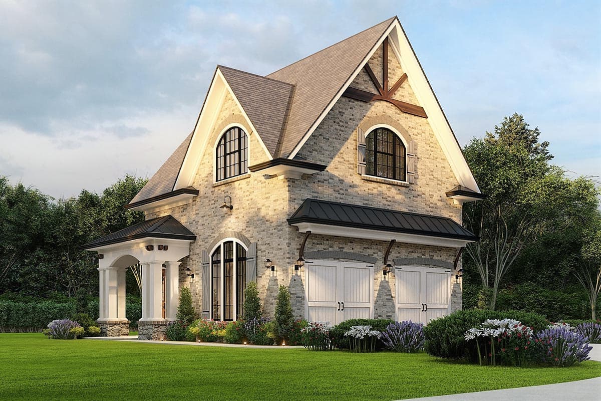 House plan exterior featuring a brick facade, arched windows, porte-cochère with columns, and a three-car garage.