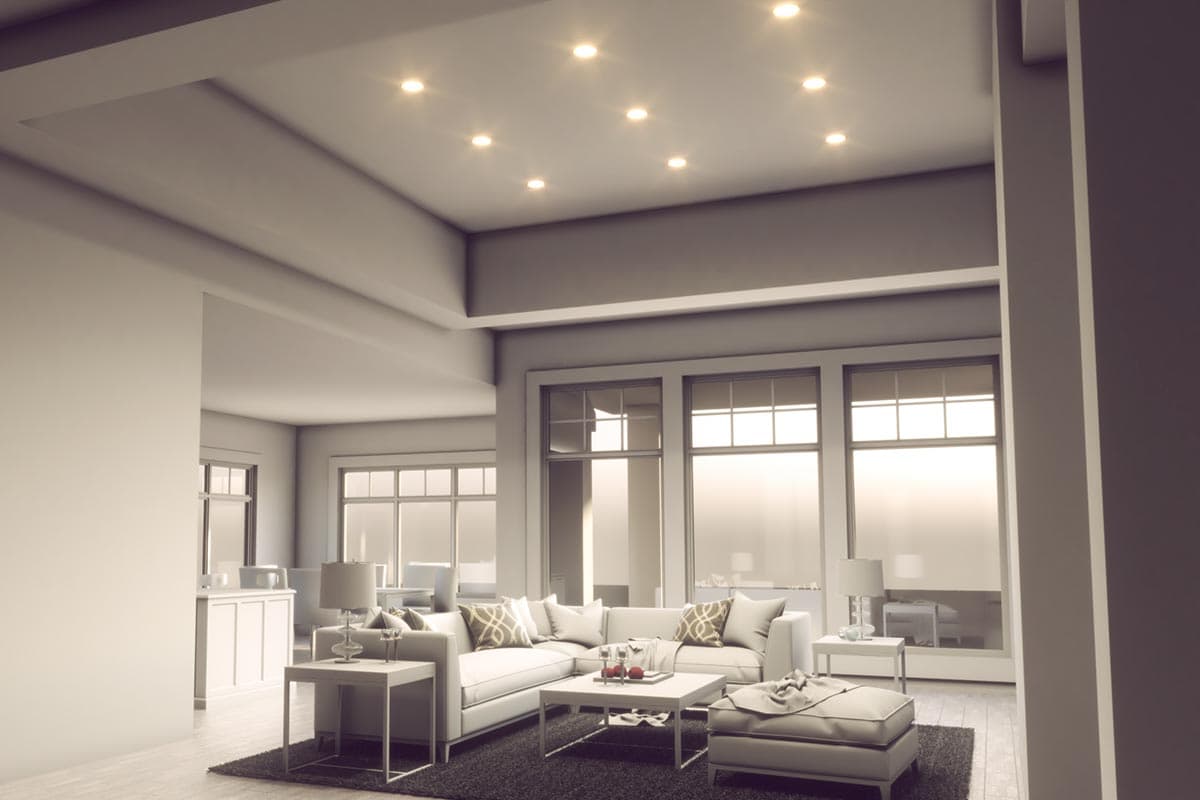 Living room rendering with sectional sofa, coffee table, and large windows. Recessed lighting and tray ceiling visible.