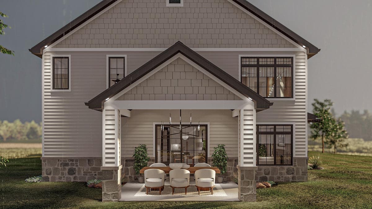Modern Farmhouse house plan exterior with stone base, horizontal siding, and covered patio with outdoor dining.