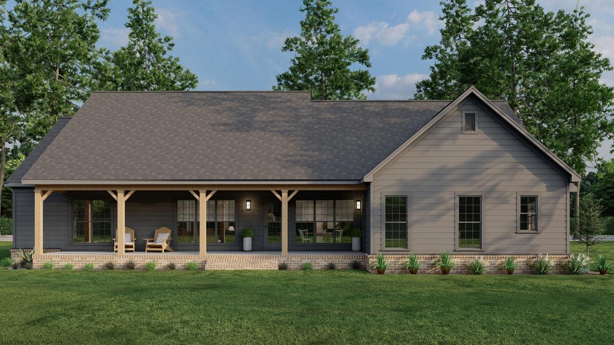 House plan exterior: Ranch-style, single-story with large covered porch, timber supports, brick foundation, and gabled dormer.