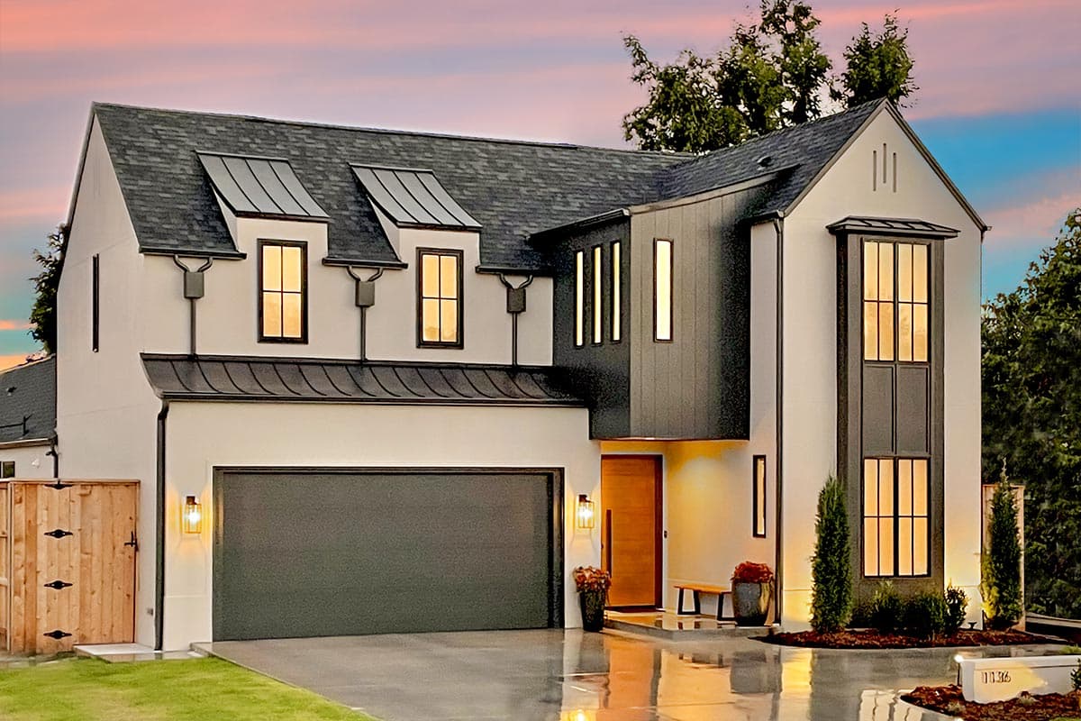 House plan exterior. Two-story Modern house with a hipped roof, dormers, and a two-car garage. Features include black metal accents.