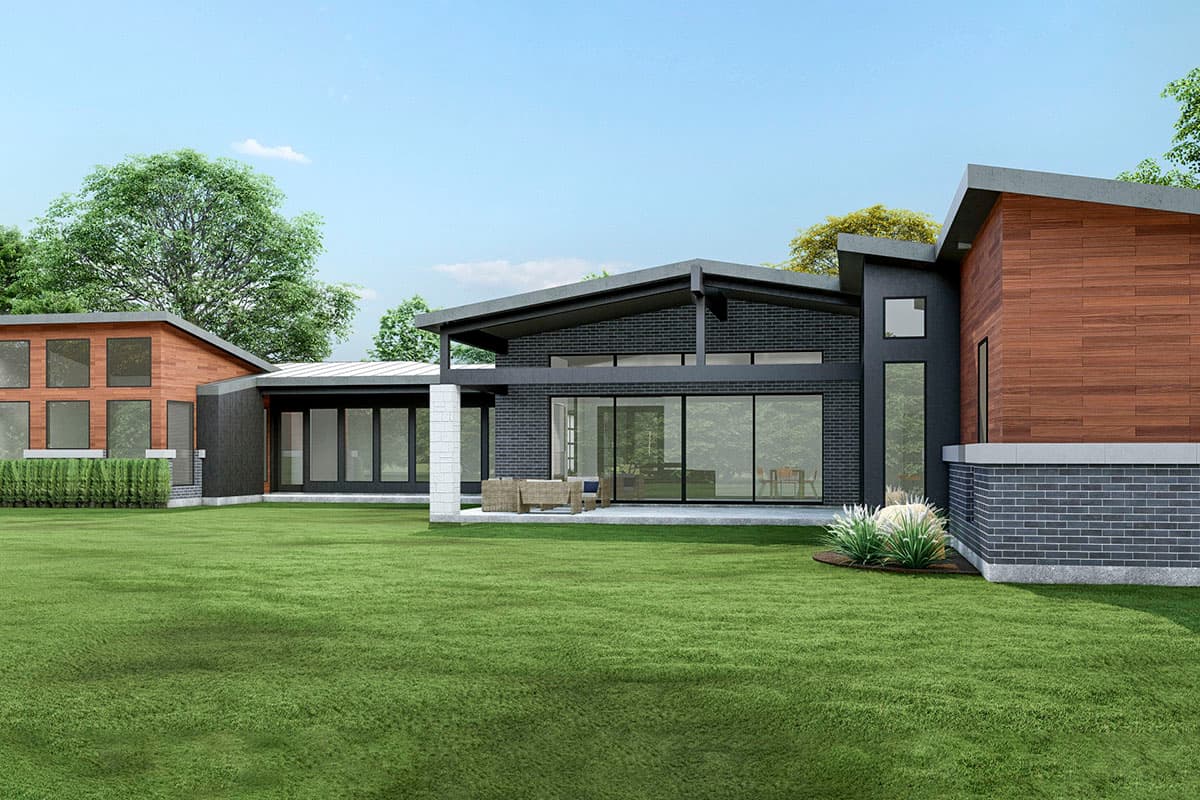 House plan exterior: Modern design with brick and wood facade, expansive windows, and butterfly rooflines.