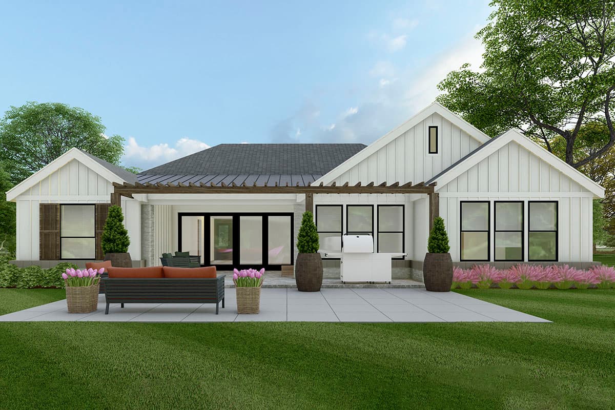 House plan exterior: Modern Farmhouse style, one story, featuring a pergola, gabled dormers, and large windows.