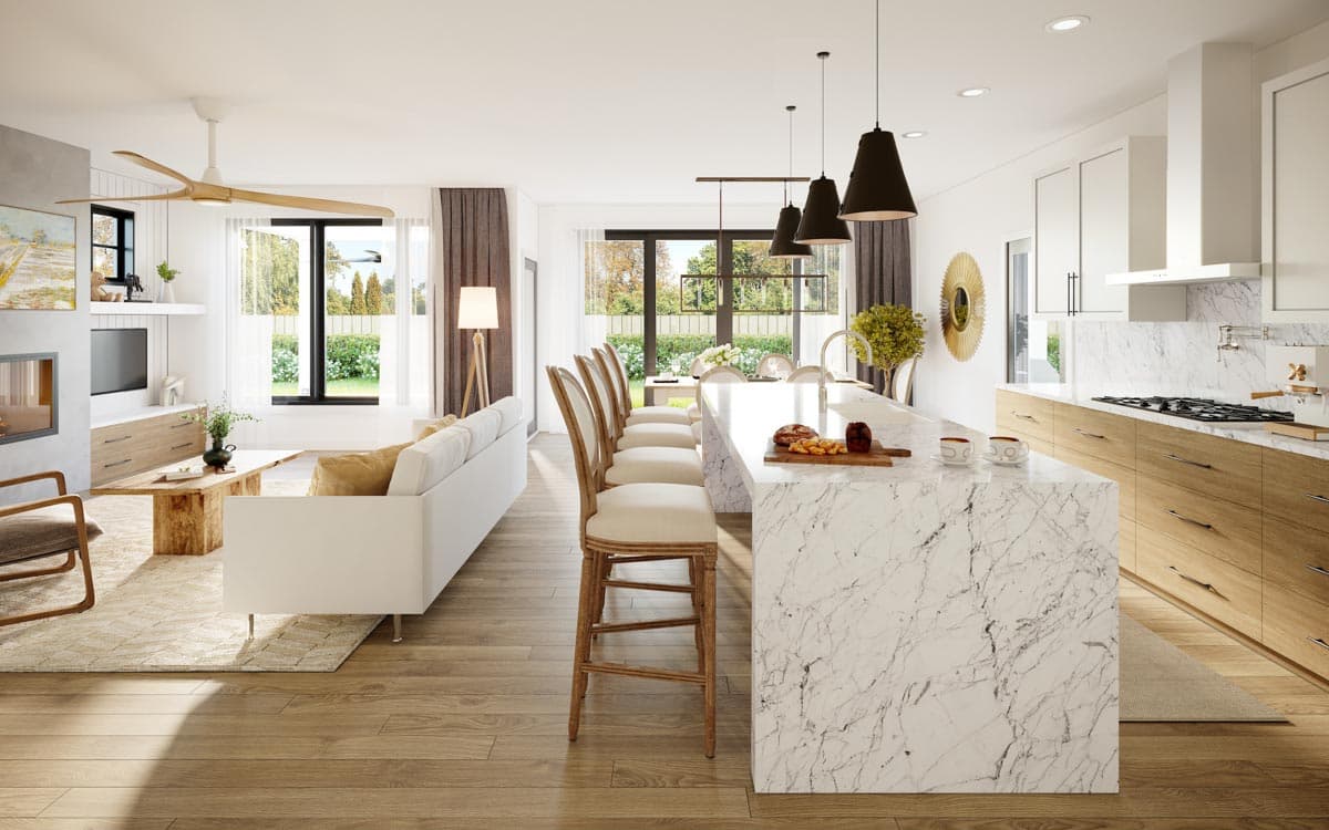 A modern, open-plan living space features a kitchen island with bar stools, flowing into a living room with a couch, fireplace, and large windows.