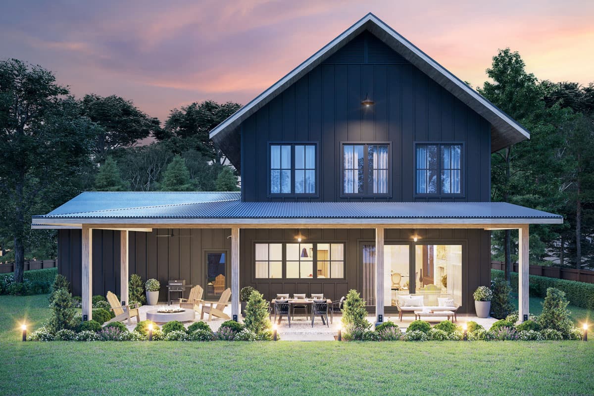 Modern Farmhouse style house plan exterior. Two stories, dark vertical siding, gabled roof, and covered rear porch with seating areas.