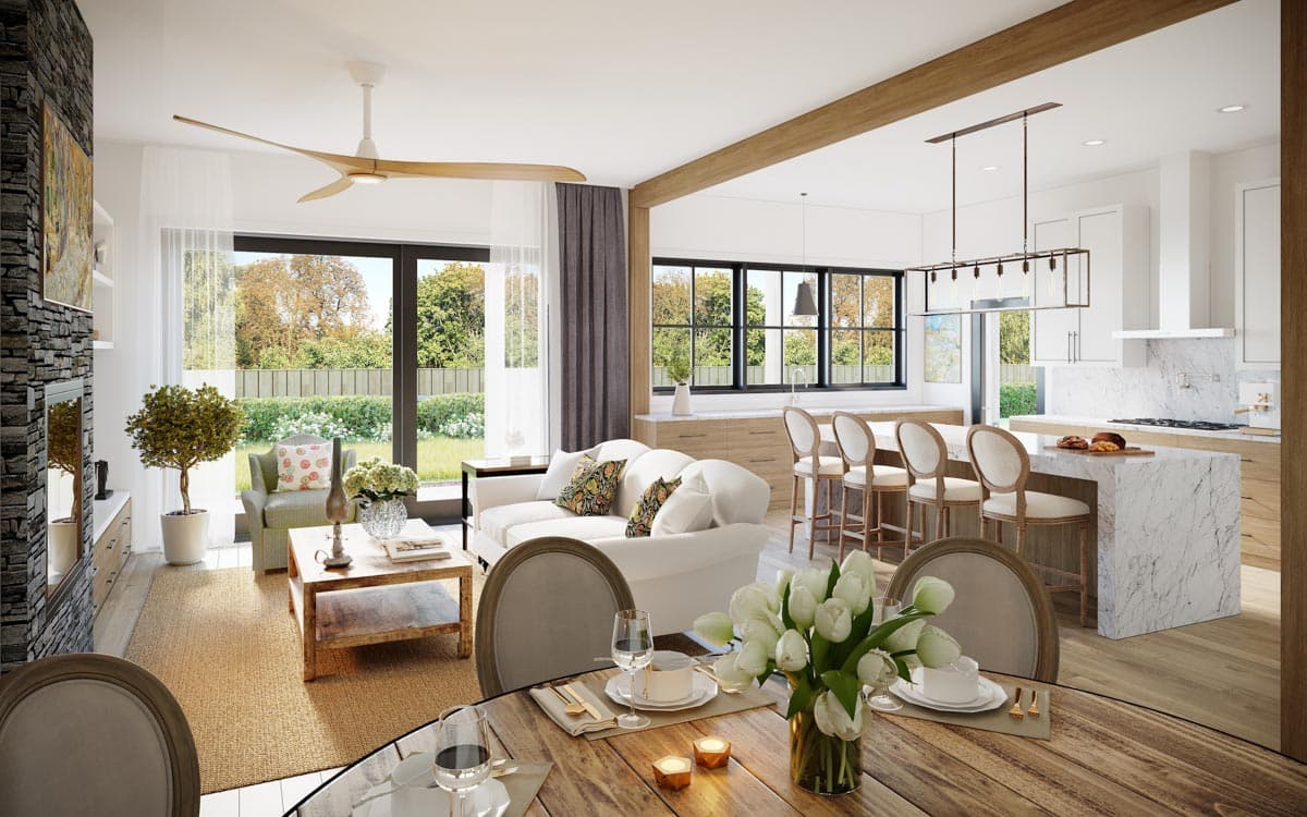 Open concept living and kitchen area with island, fireplace, large windows, and a ceiling fan.