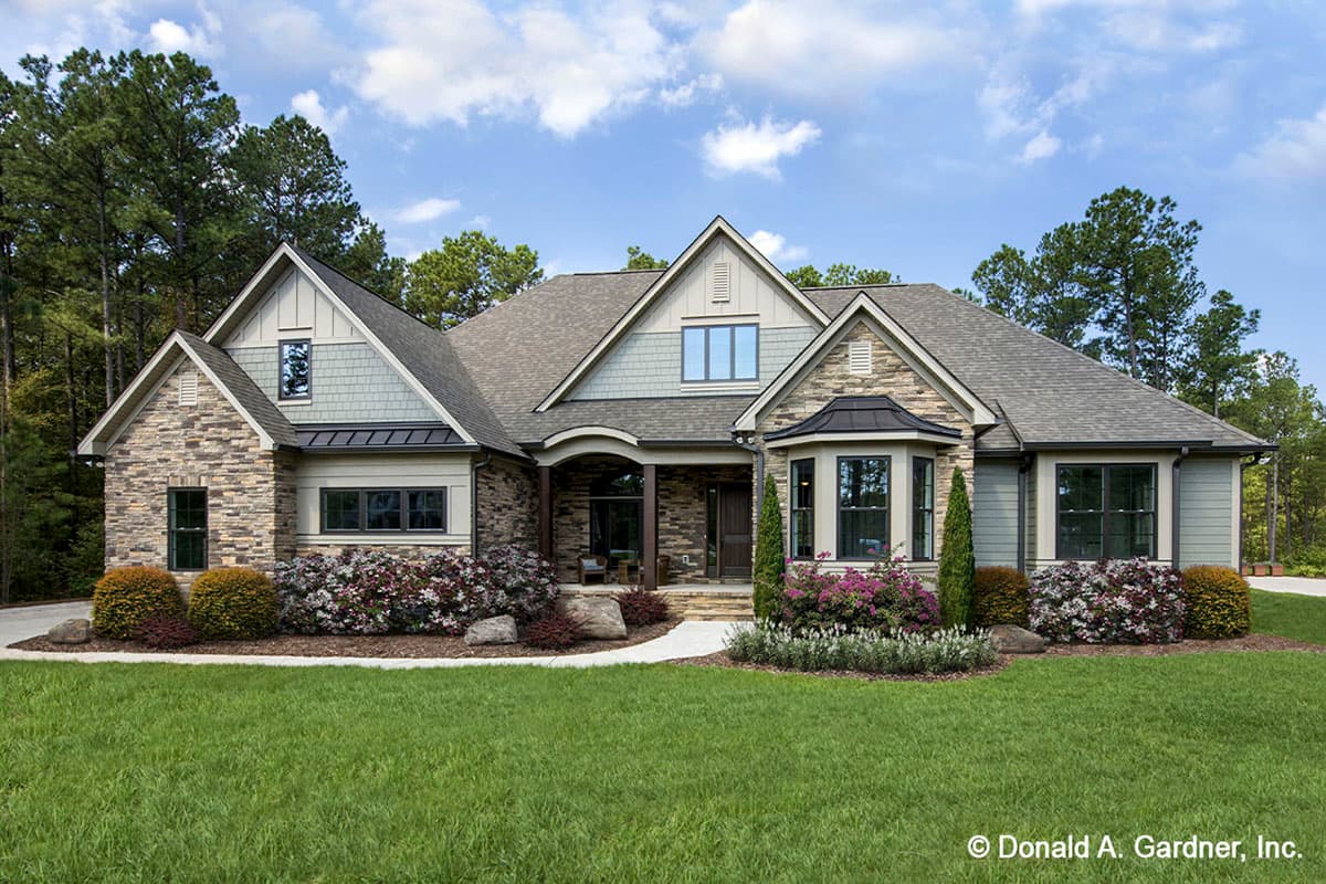 House plan exterior. Craftsman style, single-story home with gables, a covered porch, and a bay window.