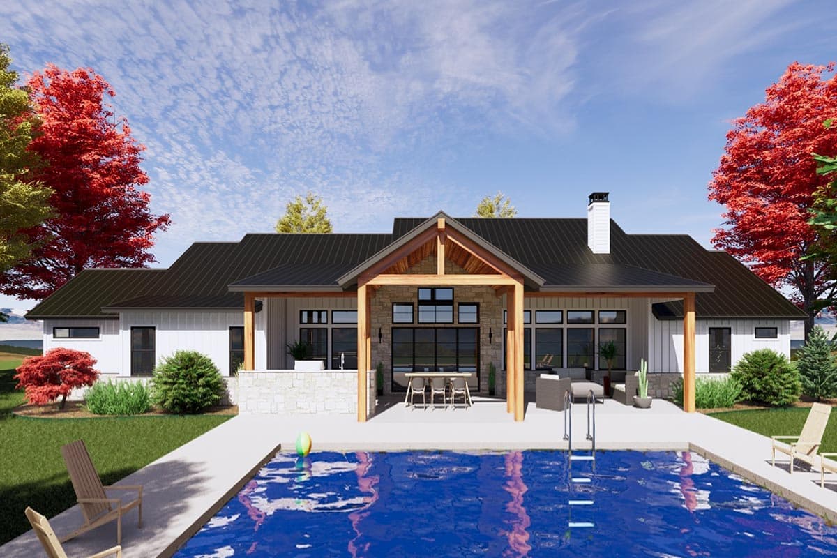 Modern Farmhouse house plan exterior with a covered patio, stone accents, metal roof, and attached garage.