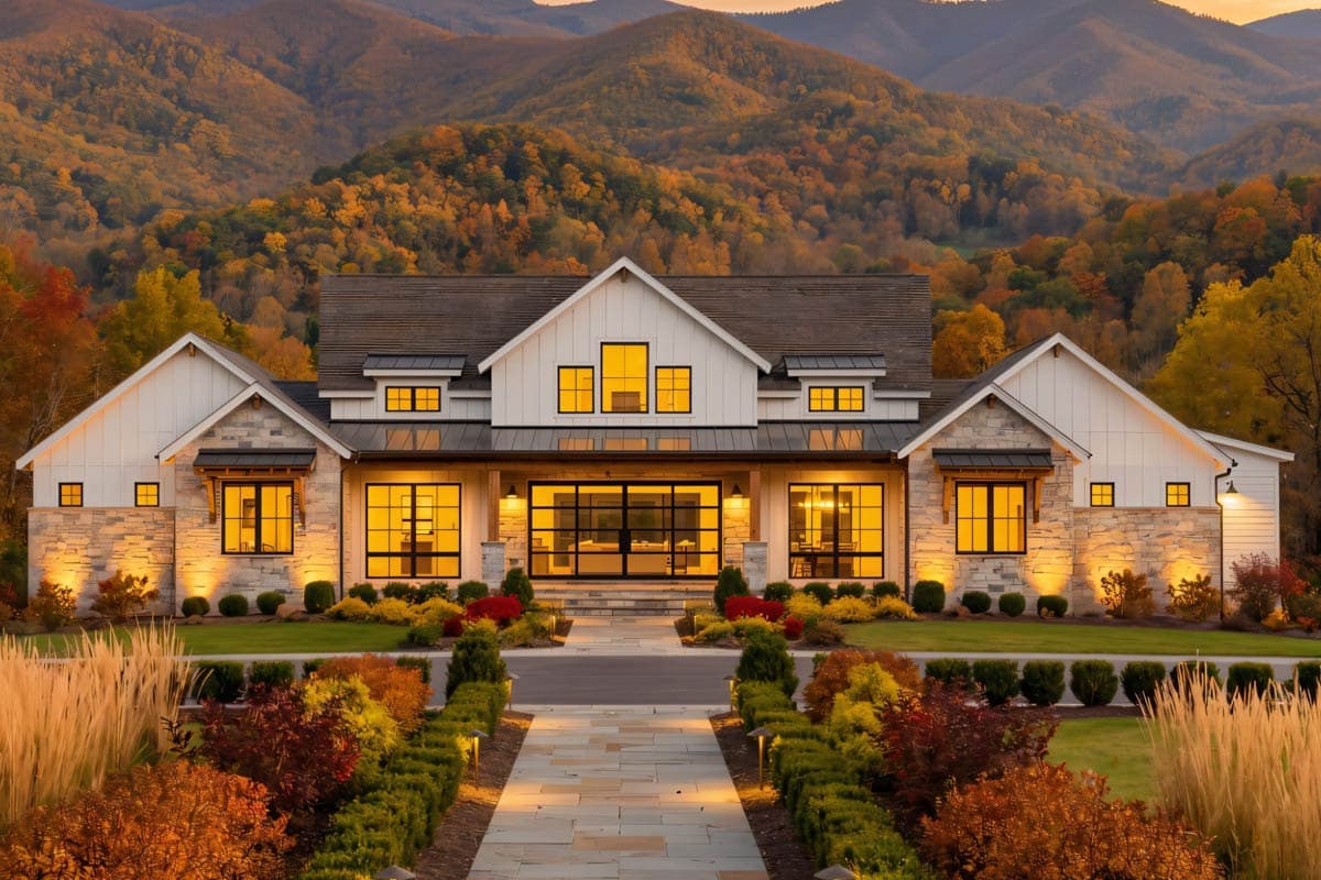 House plan exterior: Modern Farmhouse style, two stories, gable rooflines, stone and board-and-batten siding, and large windows.