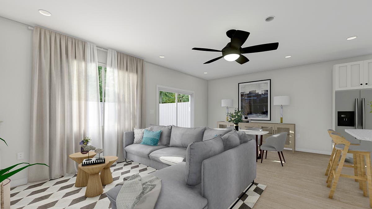 Rendering of an open-concept living area with a sectional sofa, dining table, and kitchen island.