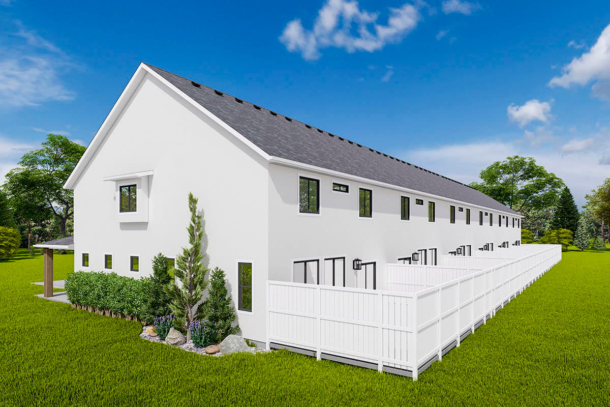 Modern farmhouse house plan exterior, two stories, gabled roof, large white fence, numerous windows, and small covered entryway.