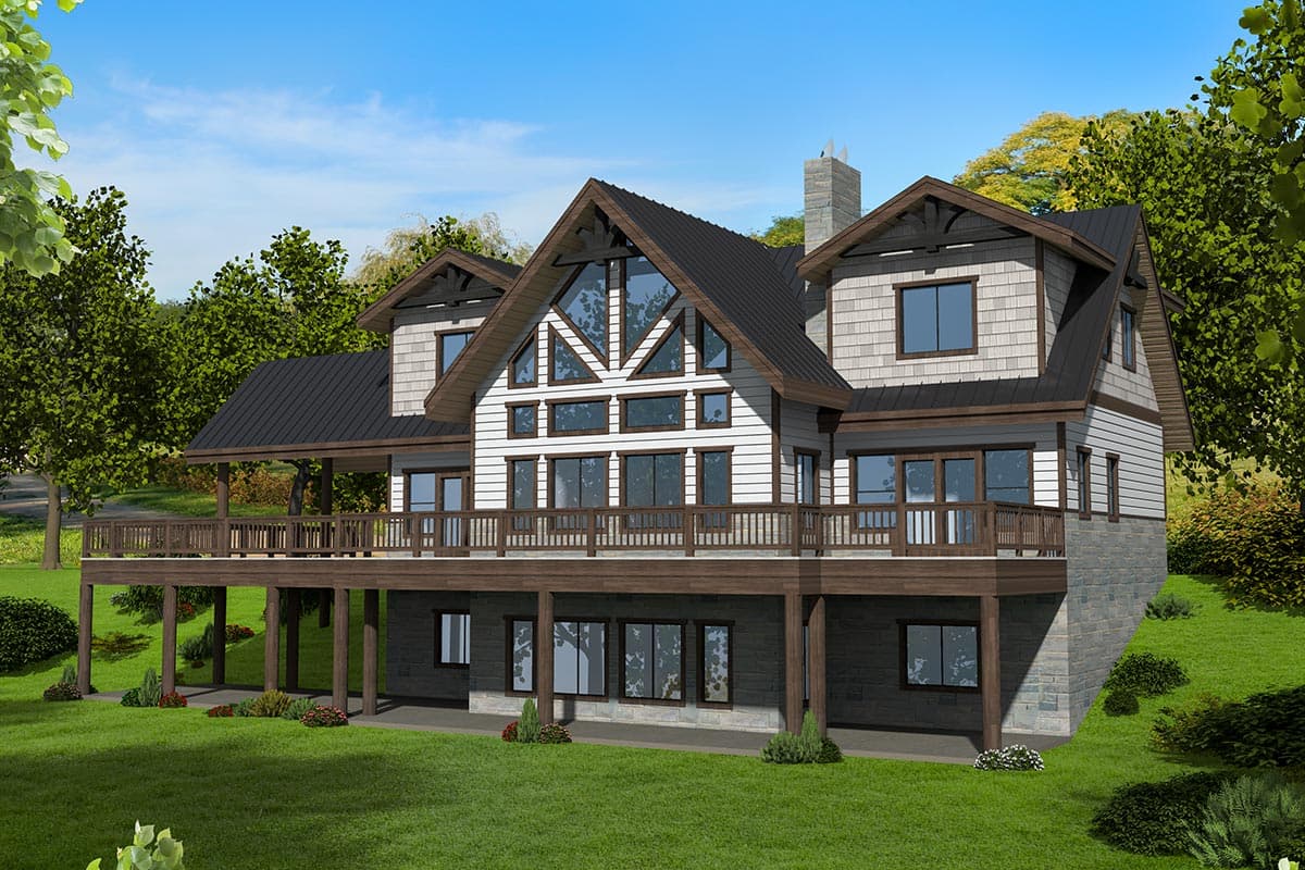 House plan exterior with two stories, board and batten siding, multiple gables, a wraparound deck, and a dark metal roof.