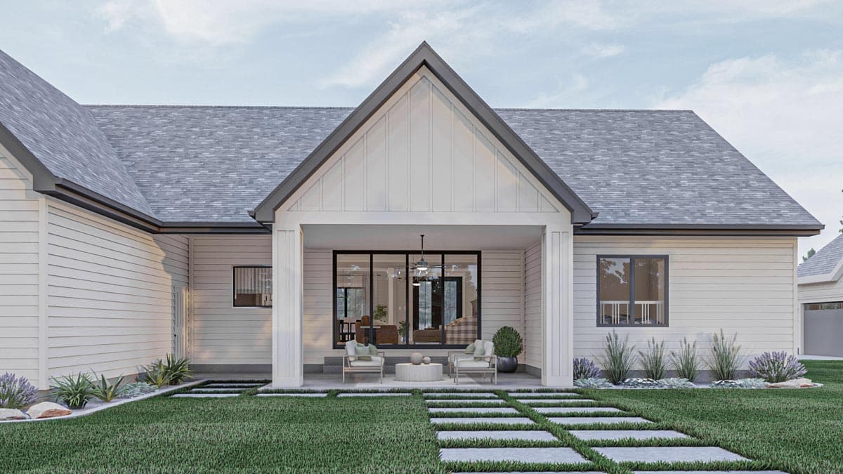 Modern Farmhouse house plan exterior with white horizontal siding, gabled entrance, and covered patio.