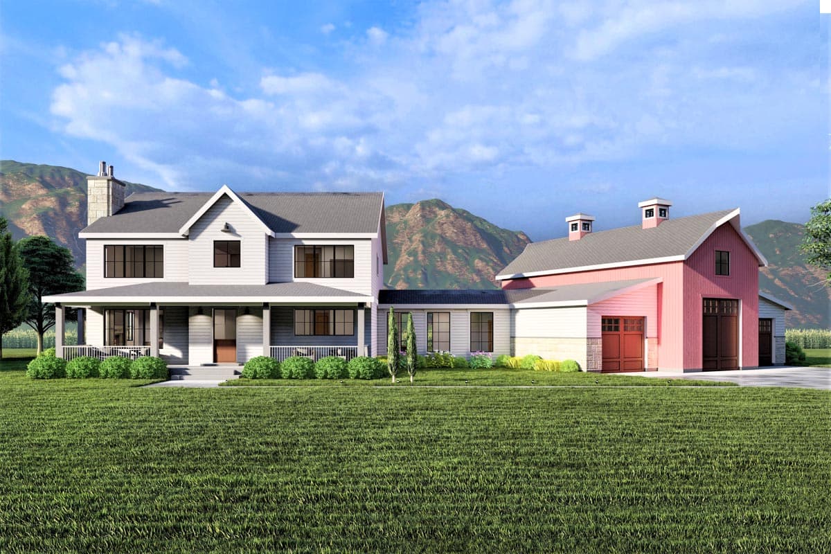 House plan exterior featuring a two-story farmhouse with a wraparound porch, gabled roof, and attached barn with a garage.